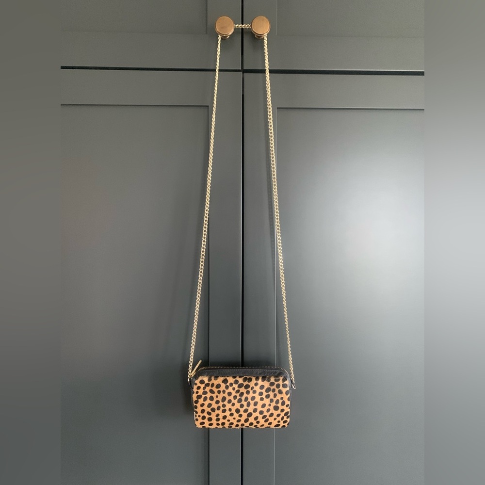 Loeffler Randall mini calf hair crossbody bag.